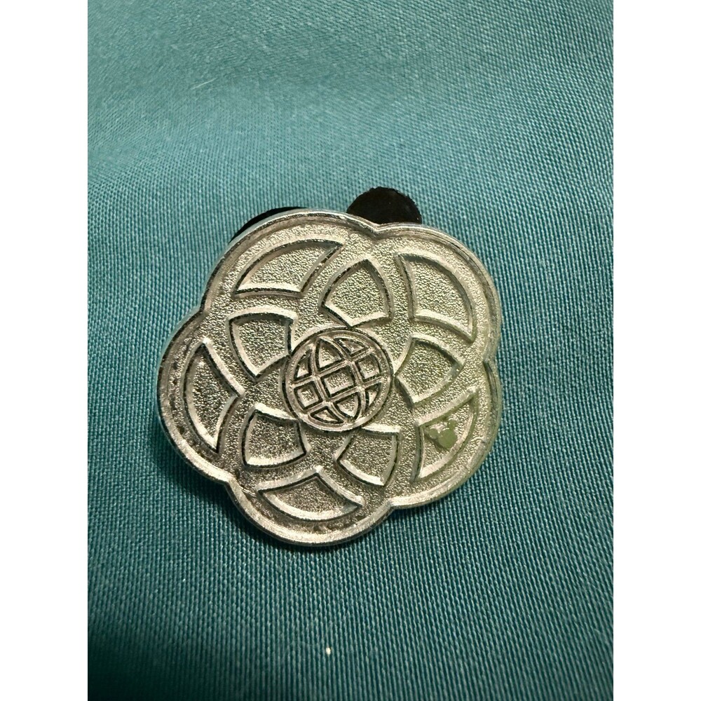 Disney Hidden Mickey "Chaser" Pin featuring a stylized geometric flower EPCOT